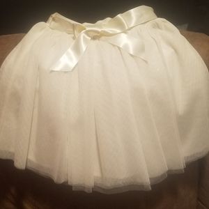 Ivory colored tulle skirt with satin ribbon